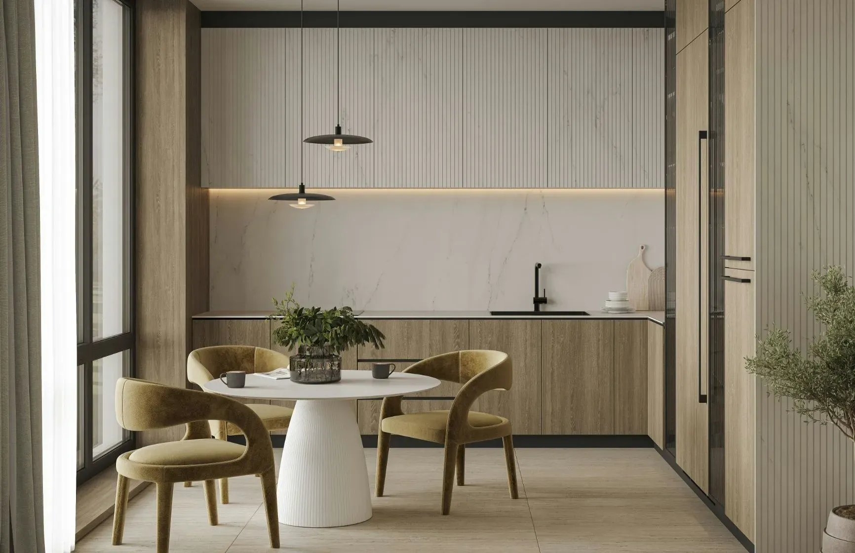 Kuchnia z jadalnią i jasną ścianą z Dekton z kolekcji Ukiyo, okrągły stół i złote krzesła